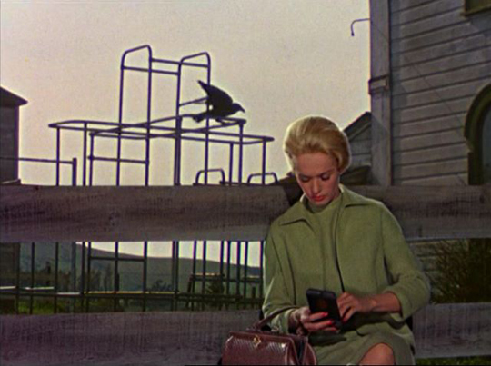 Melanie, although concerned, remains oblivious of the gathering threat in Alfred Hitchcock's The Birds (1963)