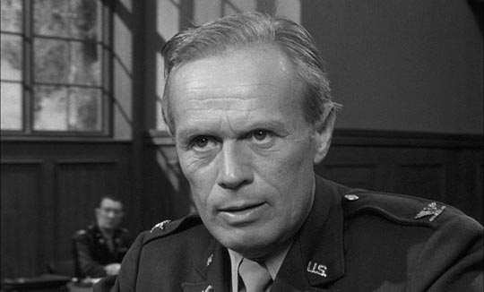 Richard Widmark as prosecutor Colonel Lawson