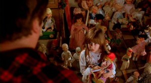 Carrie Lorraine as Judy, holding on to her Punch doll, in Stuart Gordon's creepy fairytale Dolls (1986)