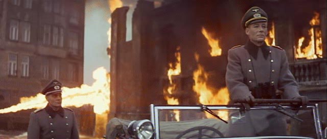 Major Grau (Omar Sharif) witnesses General Tanz' (Peter O'Toole) pleasure in destruction