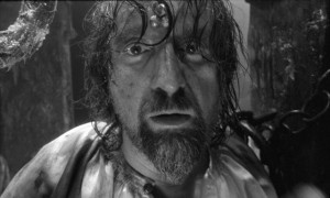 Don Rumata (Leonid Yarmolnik) driven mad by his enforced role of detached observer in Aleksei German's science fiction epic Hard to Be a God (2013)