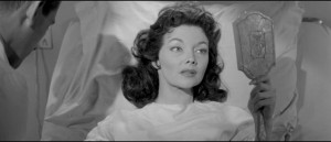 Kyra Zelas (Mari Blanchard) miraculously restored to health by an experimental serum in Kurt Neumann's She Devil (1957)