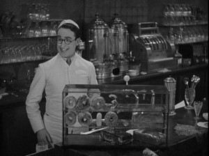 Harold "Speedy" Swift ingeniously passes on the ball score to his co-workers in Speedy (1928)