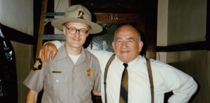 Yes, that's me, the least convincing state trooper ever to appear on screen, hanging out with the very affable Ed Asner on the set of Paul Shapiro's Heads (1994)