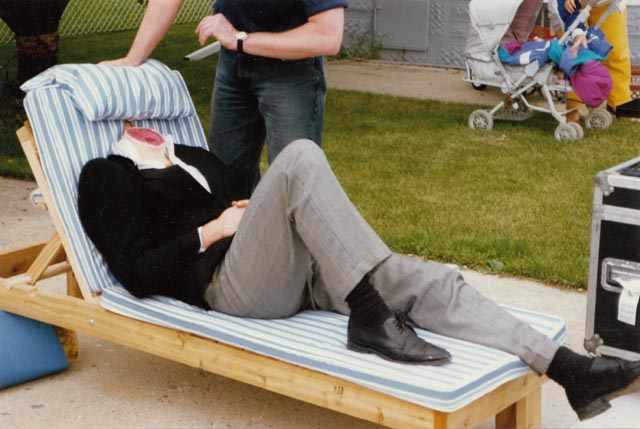 One of the victims being prepped for his on-camera moment ... yes, that's a real body; the head is hidden by the cushion on Paul Shapiro's Heads (1994)