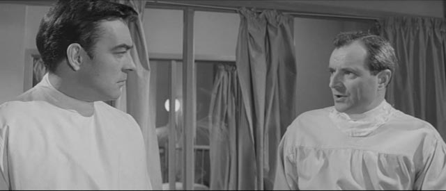 Richard Johnson and Michael Goodliffe as doctors working together despite personal conflicts in Val Guest's 80,000 Suspects (1963)