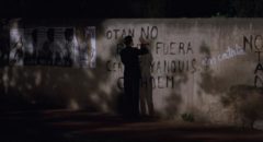 Fred (Chris Eigeman) attempts ineffectually to erase anti-American graffiti with a marker in Whit Stillman's Barcelona (1994)