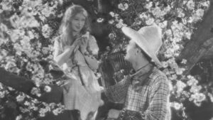 Mae Feather (Annette Benson) and Julian Gordon (Brian Aherne) shooting the film-within-the-film in Anthony Asquith's Shooting Stars (1928)