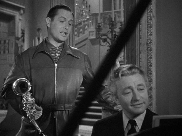 Mr. Jordan (Claude Rains) tries to convince Joe he should take the body of murdered businessman Bruce Farnsworth in Alexander Hall's Here Comes Mr. Jordan (1941)