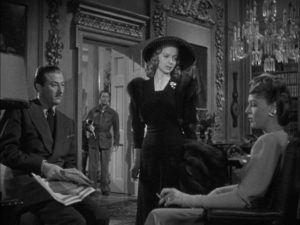Bette Logan (Evelyn Keyes) gets the brush-off from Julia Farnsworth and Tony Abbott in Alexander Hall's Here Comes Mr. Jordan (1941)