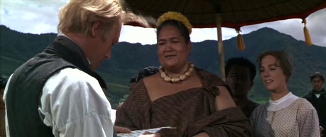 Malama (Jocelyne LaGarde) proudly shows Reverend Hale (Max von Sydow) the letter she has written to the President in George Roy Hill's Hawaii (1966)