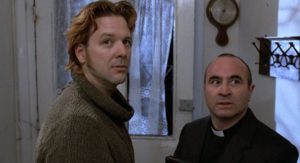 Mickey Rourke as the IRA killer Fallon and Bob Hoskins as the priest in Mike Hodges' A Prayer for the Dying (1987)