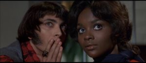 Z-Man Barzell with Carrie Nations drummer Petronella Danforth (Marcia McBroom) in Russ Meyer's Beyond the Valley of the Dolls (1970)