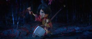 Kubo (Art Parkinson) uses his mother's shamisen in his fight with the Moon King in Travis Knight's Kubo and the Two Strings (2016)