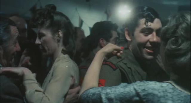 Tom Rouse, the father, meets Dulcie (Mary Hammond) at a village dance during World War Two in Peter Hall's film of Ronald Blythe's Akenfield (1974)