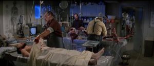 The research team attempt to figure out the nature of the threat in John Carpenter's The Thing (1982)