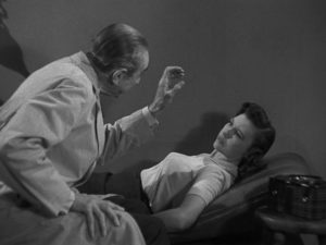 Dr Vornoff Bela Lugosi) uses his hypnotic powers to control Janet Lawton (loretta King)