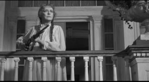 Bette Davis as Charlotte, defending her estate from the State's demolition crew in Robert Aldrich's Hush ... Hush, Sweet Charlotte (1964)