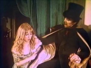 Hyde gets rough with singer April Conners (Julia Stratton) in Andy Milligan's The Man With Two Heads (1972)