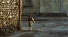 Minek (Omar Brignoli) walking to school in Ermanno Olmi's The Tree of Wooden Clogs (1978)