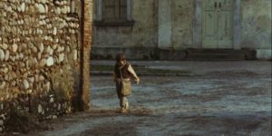 Minek (Omar Brignoli) walking to school in Ermanno Olmi's The Tree of Wooden Clogs (1978)