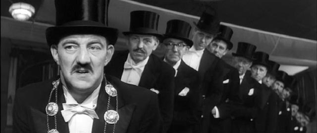 The mayor (Bryan Pringle) and council are unsure whether they're being mocked in Ken Russell's French Dressing (1964)