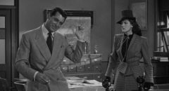 Walter Burks (Cary Grant) tries to railroad ex-wife Hildy Johnson (Rosalind Russell) into staying with the newspaper in Howard Hawks' His Girl Friday (1940)