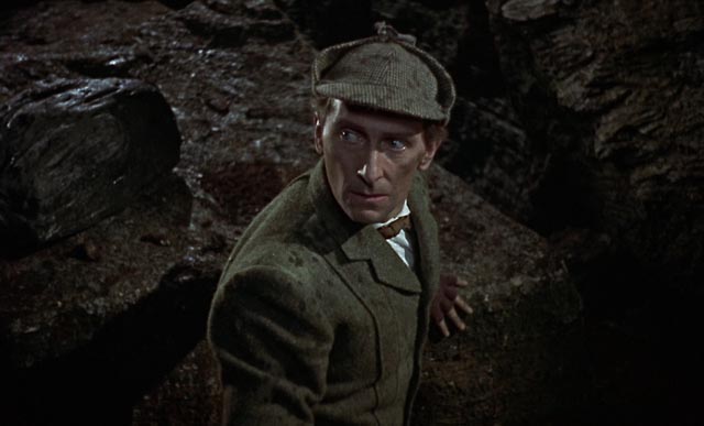 Peter Cushing as Sherlock Holmes, confronting evil in Terence Fisher's The Hound of the Baskervilles (1959)