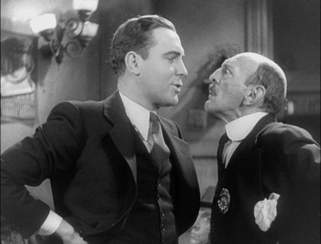 Hildy (Pat O'Brien) faces down corrupt Sheriff Hartman (Clarence Wilson) in Lewis Milestone's The Front Page (1931)