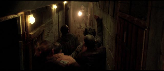 Zombies in tight spaces in Yannick Dahan & Benjamin Rocher's La horde (2009)