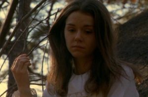 Lisa (Leslie Lee) haunted by some trauma which remains hidden in Frederick R. Friedel's Axe (1974)