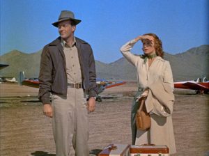 Geraldine Carson (Rhonda Fleming) and Joseph Duncan (William Lundigan) abandon her injured husband to his fate in Roy Ward Baker's Inferno (1953)