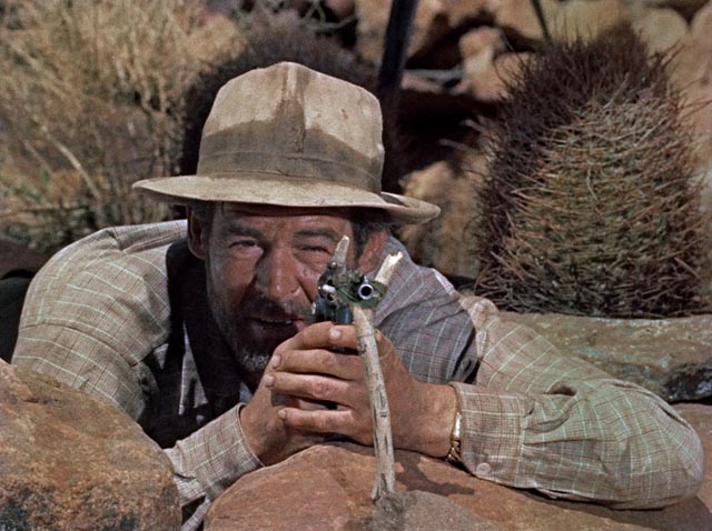 Carson (Robert Ryan) takes aim at some food in the desert in Roy Ward Baker's Inferno (1953)