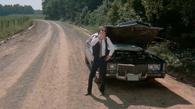 At the mercy of contingency: Eddie (Jack Canon) contemplates the breakdown in the middle of nowhere in Frederick R. Friedel's Kidnapped Coed (1975)