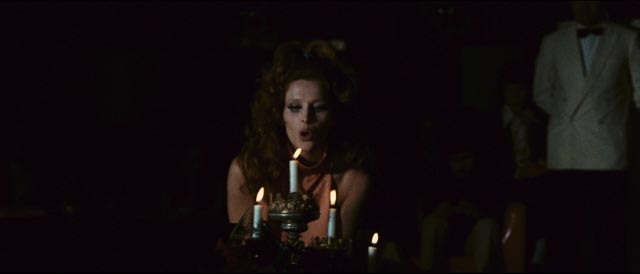 Erika Blanc emerges from a coffin for a kinky strip routine at a decadent club in Emilio P. Miraglia's The Night Evelyn Came Out of the Grave (1971)