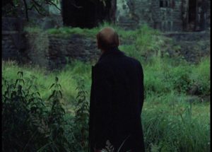 The Writer is stopped before he reaches the building which houses the Room in Andrei Tarkovsky's Stalker (1979)