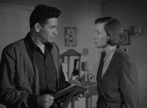 Harry's marriage to Lucy (Phyllis Thaxter) is under stress in Michael Curtiz's The Breaking Point (1950)