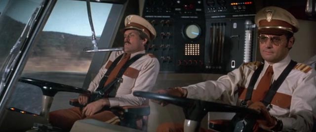 Joseph Bologna (r) as Captain of The Big Bus, with co-pilot John Beck