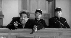 Braconnier (Michel Simon) argues that the law supports his act of murder in Sacha Guitry's La poison (1951)