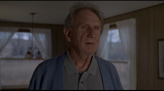 Albert (Rene Auberjonois) watches as Gina and her friends take away his pile of stones in Kelly Reichardt's Certain Women (2015)