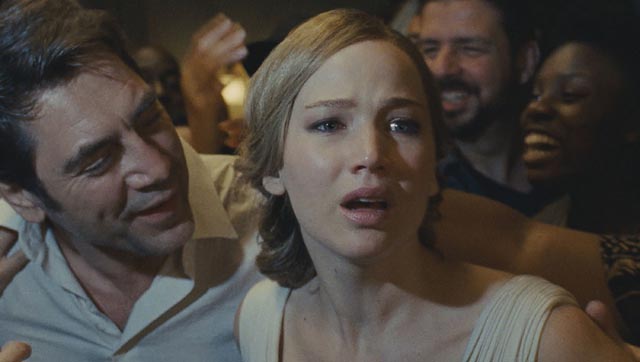 Him (Javier Bardem) tries to convince Mother (Jennifer Lawrence) to appreciate his rioting fans in Darren Aronofsky's mother! (2017)