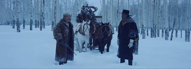 Bounty hunters Samuel L. Jackson and Kurt Russell meet cute in Quentin Tarantino's The Hateful Eight (2015)