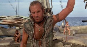The Mariner (Kevin Costner) reluctantly takes on passengers Helen (Jeanne Tripplehorn) and Enola (Tina Majorino) in Kevin Reynolds' Waterworld (1995)