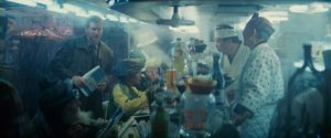 Deckard (Harrison Ford) orders noodles in a crowded street in Ridley Scott's Blade Runner (1982) ...