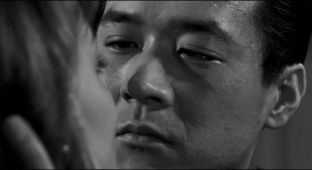 Joe is conflicted by his attraction to Christine (Victoria Shaw) in Samuel Fuller's The Crimson Kimono (1959)