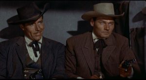Southern gentlemen Philip Carey and Leo Gordon reveal their hidden motives in Raoul Walsh's Gun Fury (1953)