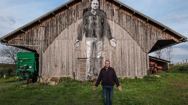 The farmer who works the land alone with his computerized tractor in Agnes Varda's Visages Villages (2017)