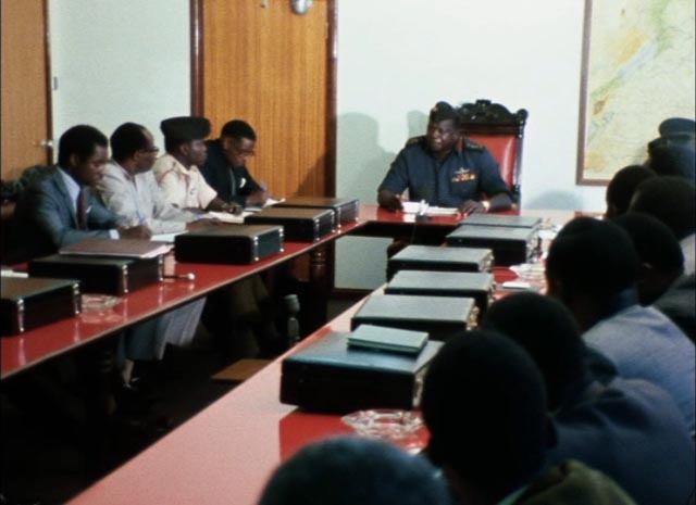 Amin lectures his cabinet on their primary duty: to make the people love him in Barbet Schroeder's General Idi Amin Dada: A Self-Portrait (1974)