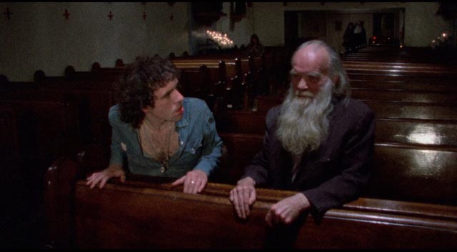 Reno (Abel Ferrara as Jimmy Laine) is horrified by an old derelict in church in Ferrara's The Driller Killer (1979)