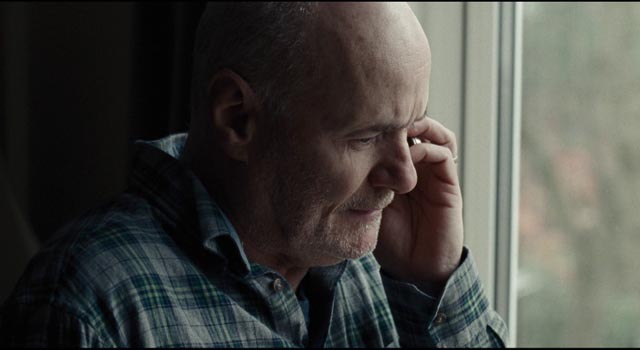 Daniel spends hours on hold as he tries to navigate the Kafkaesque bureaucracy in Ken Loach's I, Daniel Blake (2016)